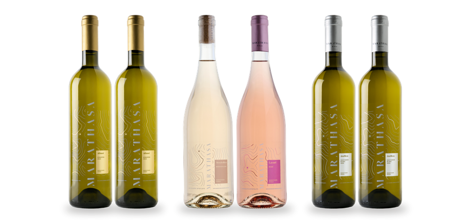 Six bottles of Marathasa wine, consisting of two white wines with gold labels, two light-coloured wines, and two white wines with white labels.